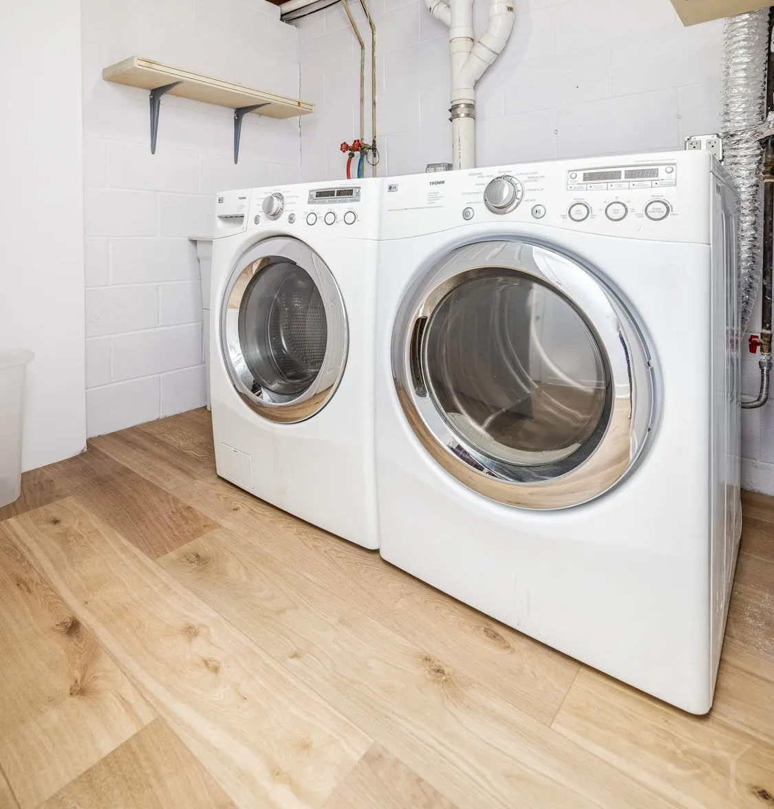 Laundry room with a white washer and dryer